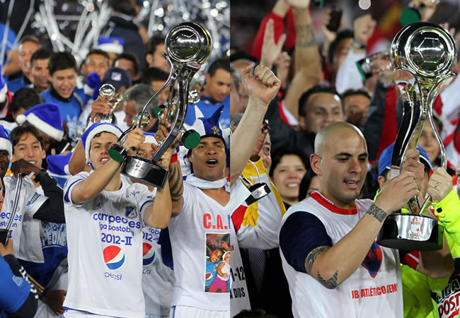 Los jugadores de Milonarios y Santa Fe, Pedro Franco y Omar Pérez con la copa de campeón en el primer y segundo torneo de 2012. Foto: EFE