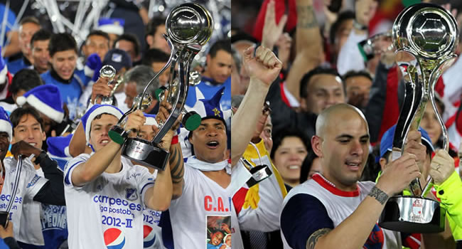 Los jugadores de Milonarios y Santa Fe, Pedro Franco y Omar Pérez con la copa de campeón en el primer y segundo torneo de 2012. Foto: EFE