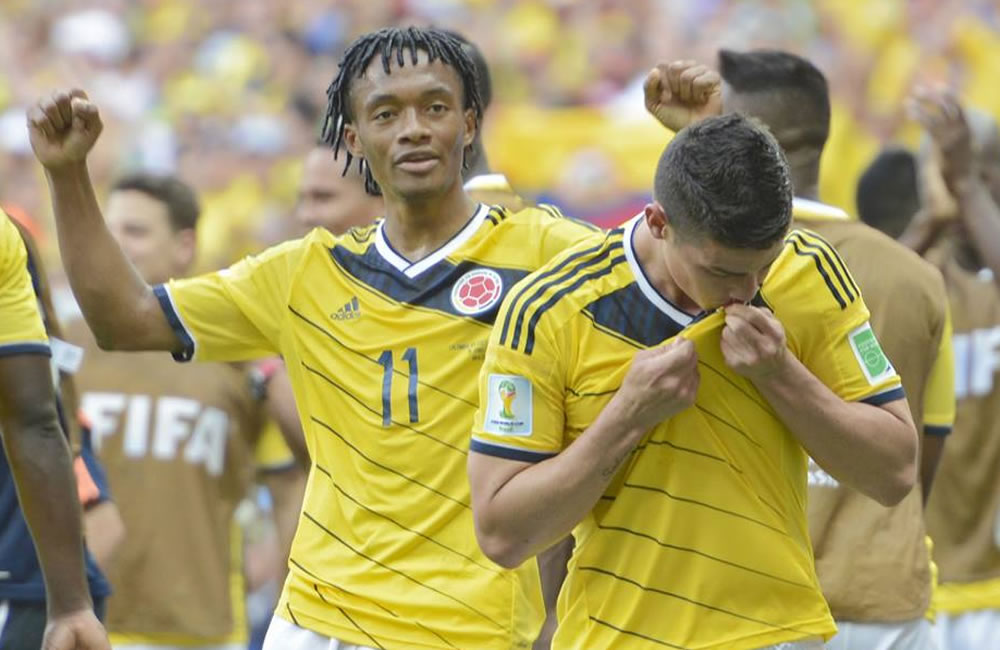 El centrocampista de la selección de Colombia Juan Cuadrado junto con James Rodríguez. Foto: EFE