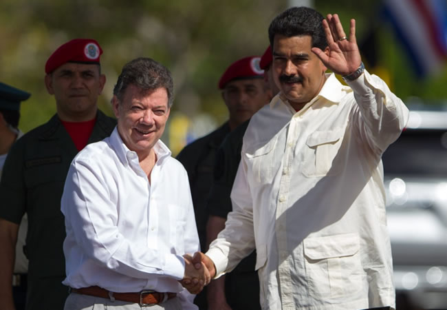 El presidente, Juan Manuel Santos y el presidente de Venezuela Nicolás Maduro. Foto: EFE