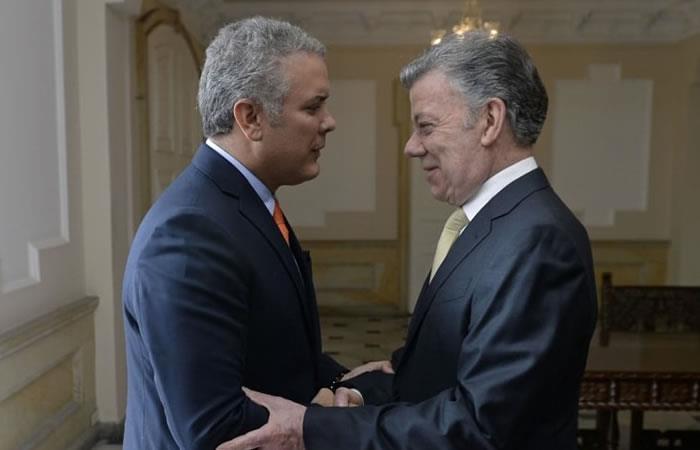 El presidente Iván Duque y el exmandatario Juan Manuel Santos. Foto: AFP