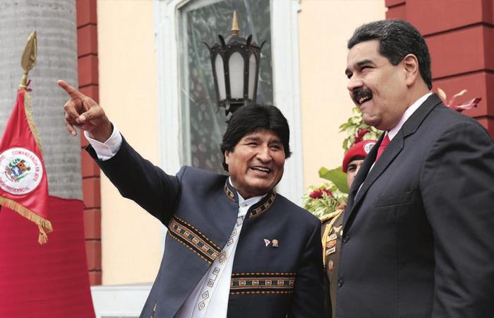 Evo Morales durante una reunión con Nicolás Maduro. Foto: Twitter