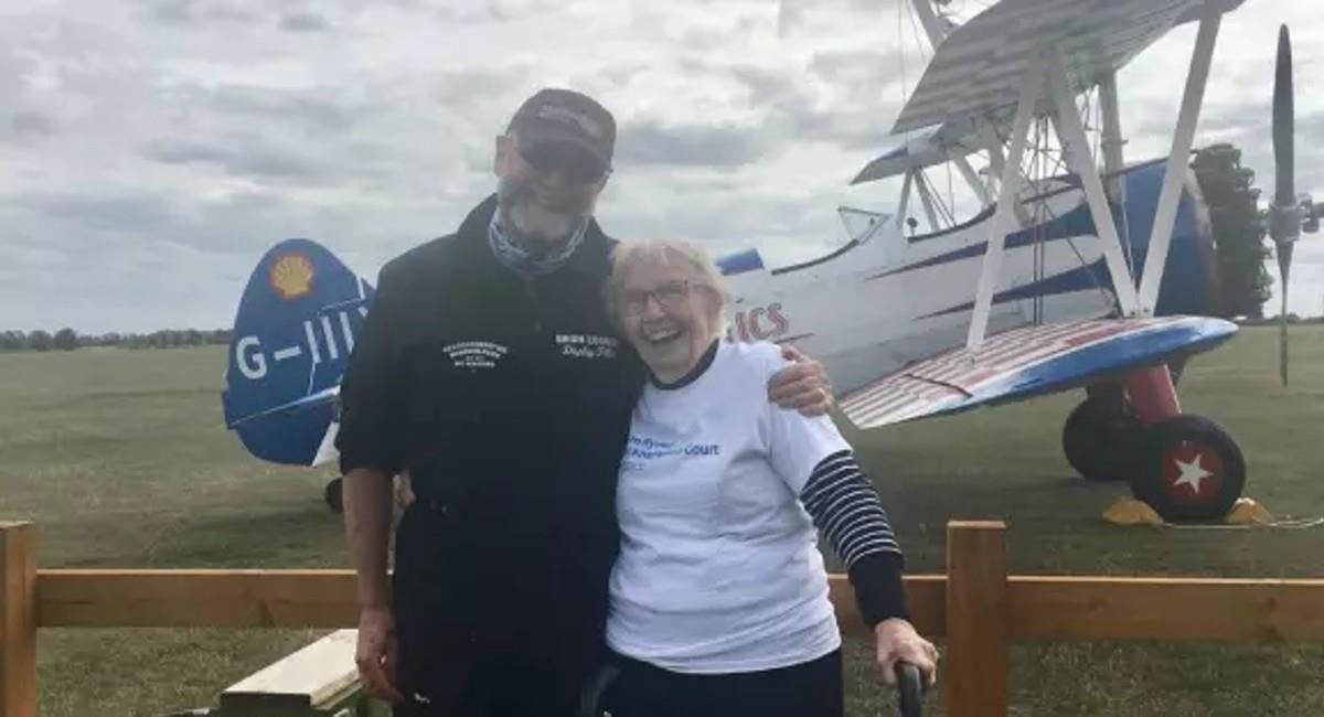 For a good cause, a 93 year old woman flies tied to an airplane wing